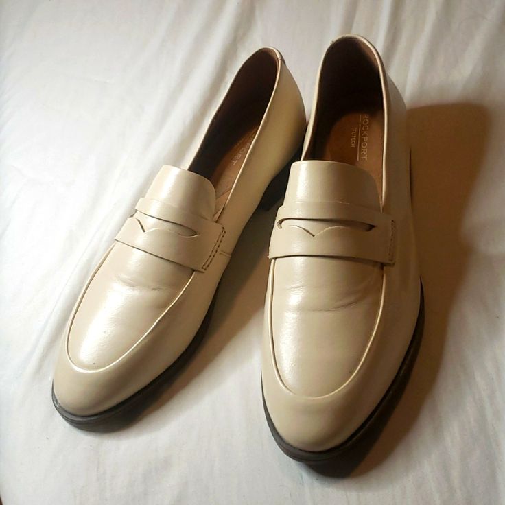 Rockport Cream Coloured Loafers Classic Cream Slip-on Moccasins, Beige Formal Slip-ons For Fall, Formal Beige Slip-ons For Fall, Classic Cream Loafers For Business, Classic Cream Flat Loafers, Classic Cream Business Loafers, Classic Beige Loafers With Brogue Detailing, Cream Loafers With Flat Heel For Formal Occasions, Classic Cream Loafers For Spring