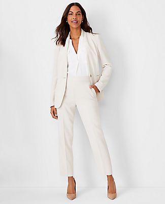 Elevate your wardrobe with the Ann Taylor Petite Long Collarless Blazer in Fluid Crepe, a masterpiece of tailoring that combines sophistication with comfort. This ivory whisper blazer is designed to flatter with its sleek, collarless V-neck and tailored fit that hits perfectly at the hip.

- **Size:** Petite 4
- **Color:** Ivory Whisper
- **Material:** 95% Polyester, 5% Spandex
- **Gender:** Female
- **Features:** Long button-open sleeves, one-button front, front besom pockets, back vent
- **Car Winter White Suits For Women, Women’s Suits For Wedding Guest, Cute Business Attire For Women, Power Business Woman Style, Collarless Blazer Women, Tailored Jackets For Women, Interview Suit Women, Women’s Pant Suits, Women’s Business Wear