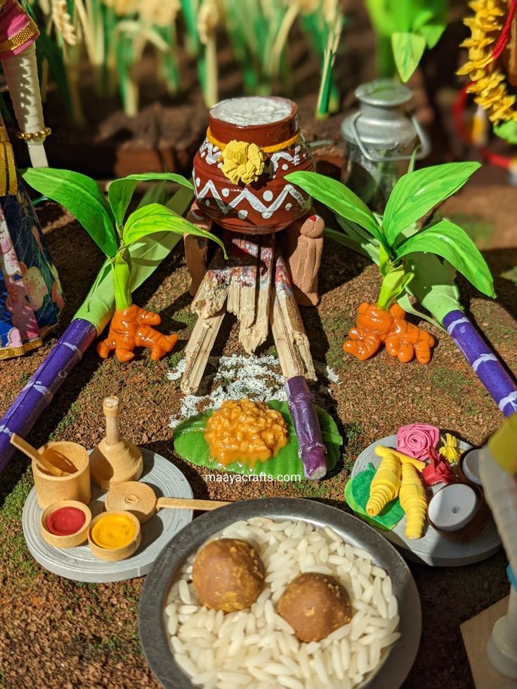 an assortment of food items displayed on the ground in front of some plants and trees