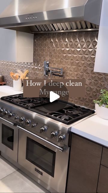 a stove top oven sitting inside of a kitchen