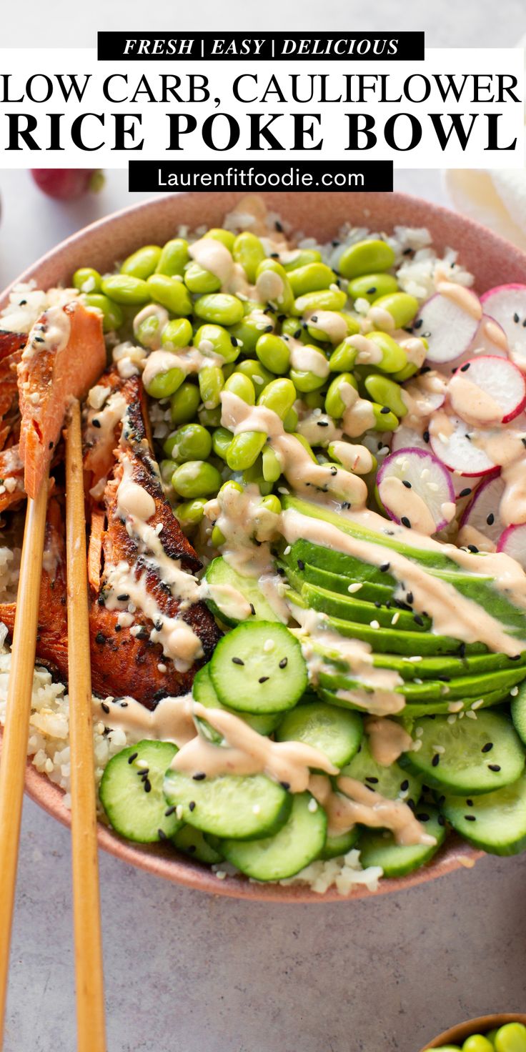 a bowl filled with rice, cucumber, and other vegetables next to chopsticks