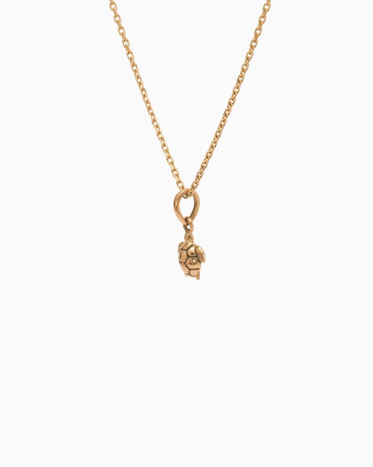 The Turtle Charm is handcrafted in 14K solid gold and features a detailed design inspired by sea turtles, celebrated as iconic symbols of the Caribbean. Playful yet sophisticated, this charm complements any look. Pair with your favorite hook bracelet or dainty chain, sold separately. Metal: 14K solid gold Dimensions: 9.5mm x 6mm x 2mm Style #: GC203S 14k Gold Symbolic Charms Jewelry, Timeless Gold Plated Charm Necklaces, Symbolic 14k Gold Charms Jewelry, Elegant Pendant Charms With Logo, Luxury 14k Gold Charms Jewelry, Luxury 14k Gold Jewelry With Charms, Elegant Pendant Logo Charm, Elegant Logo Charm Pendant, Luxury Brass Jewelry With Logo Charm