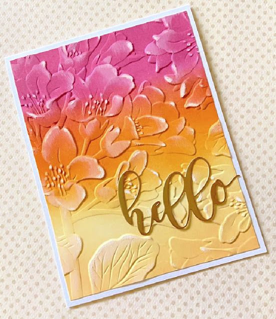 a close up of a card with flowers on it and the word hello written in gold