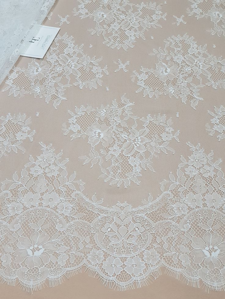 "Off white lace fabric. Both sides are scalloped. Width: 154 cm/60.6 inches Item number: LK3004 Made in Europe www.LaceToLove.com Price is set for one meter/yard. You will receive the fabric in one continuous piece if you purchase more than 1 meter/yard. IMPORTANT! Maximum one piece length of this lace is 3 meters/yards. If you buy more than 3 meters/yards of this lace you will receive it in several pieces. Actual color may vary greatly form the color you see on screen. It depends on your device Elegant Cream Lace Tulle Fabric, Cream Tulle Fabric With Scalloped Lace, Elegant Cream Tulle Fabric With Scalloped Lace, Elegant Beige Lace Tulle Fabric, White Elegant Tulle Fabric With Lace Trim, Elegant White Tulle Fabric With Lace Trim, Beige Lace Dress With Lace Trim, Elegant Cream Tulle Fabric With Delicate Lace, Elegant Cream Lace With Patchwork