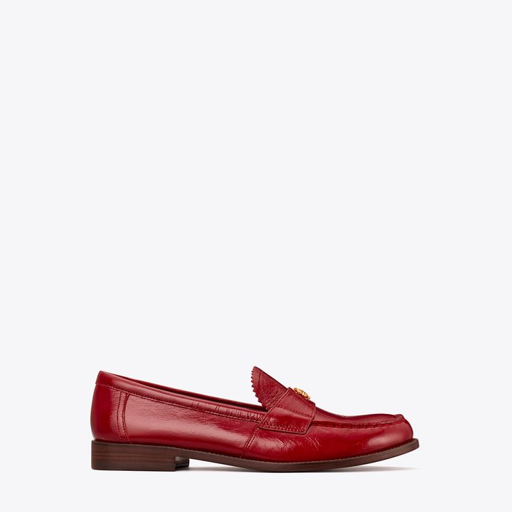 Our new classic loafer details the timeless silhouette with scalloped edges and a delicate Double T. Understated and elegant, it is crafted in soft yet durable crinkled leather.  Crafted in partnership with a Leather Working Group-certified tannery, supporting high standards in leather manufacturing and chemical management. Elegant Wingtip Tassel Loafers With Leather Lining, Classic Calf Leather Loafers With Low Heel, Elegant Calf Leather Slip-on Tassel Loafers, Elegant Calf Leather Tassel Loafers Slip-on, Elegant Slip-on Tassel Loafers With Brogue Detailing, Elegant Calf Leather Tassel Loafers With Stitched Sole, Elegant Office Tassel Loafers With Textured Sole, Elegant Tassel Loafers With Stitched Sole, Elegant Calf Leather Loafers With Brogue Detailing