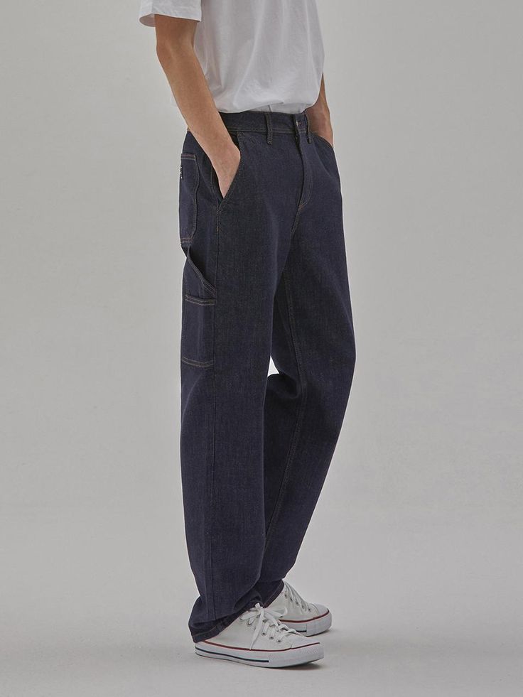 These are trendy workwear-inspired carpenter denim pants from Cork denim collaboration collection. It's cut for long and wide fit from comfortable stretch denim.- Zip and button fastening- Two front slash pockets- Four back pockets- Hammer loop- Logo leather patch at back- Wide fit Urban Straight Leg Cargo Pants For Workwear, Baggy Utility Cargo Jeans For Workwear, Urban Straight Leg Work Pants With Patch Pockets, Urban Style Straight Leg Cargo Pants For Everyday, Dark Wash Utility Rigid Denim Pants, Dark Wash Rigid Denim Utility Pants, Everyday Rigid Denim Cargo Jeans With Tapered Leg, Cargo Style Relaxed Fit Tapered Leg Jeans, Baggy Cargo Pants With Five Pockets For Work