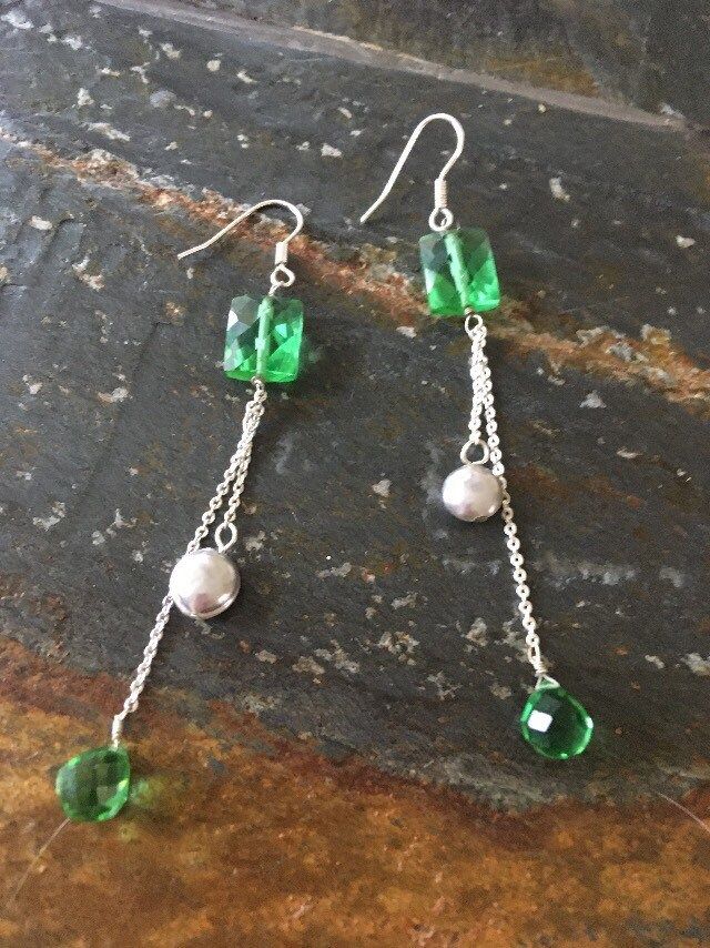 "Dangling Silver tone chain pierced earrings. Pretty green beads. 3.5\" drop. Excellent condition." Green Dangle Chandelier Earrings, Green Metal Beaded Earrings For Party, Green Metal Beaded Party Earrings, Nickel-free Green Beaded Earrings For Parties, Handmade Green Chandelier Earrings For Party, Green Beaded Chain Earrings, Green Linear Earrings For Parties, Handmade Green Crystal Metal Earrings, Green Crystal Earrings For Jewelry Making