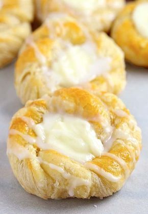 the pastry is covered with icing and drizzled in white glaze