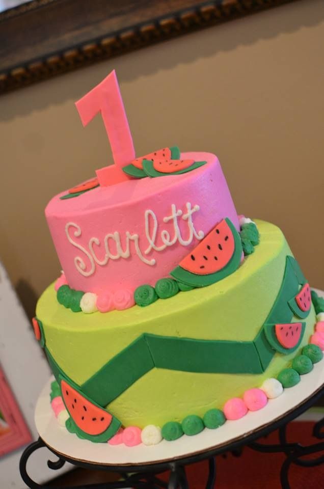 a birthday cake with watermelon on it and the number one on top is for someone's first birthday