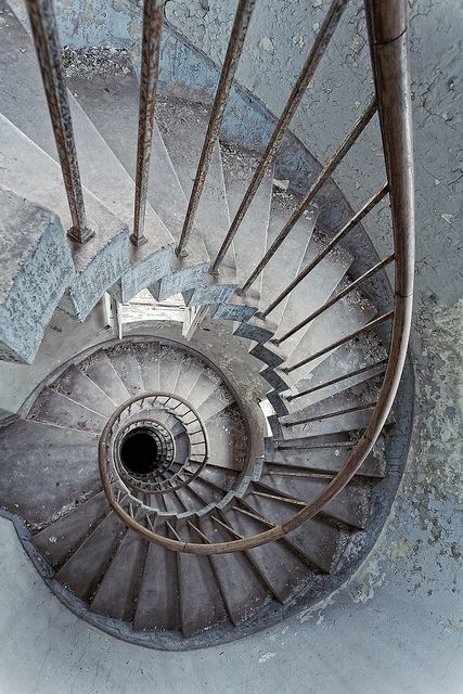 a spiral staircase with the words, bathmotobia fear of stairs or steep holes