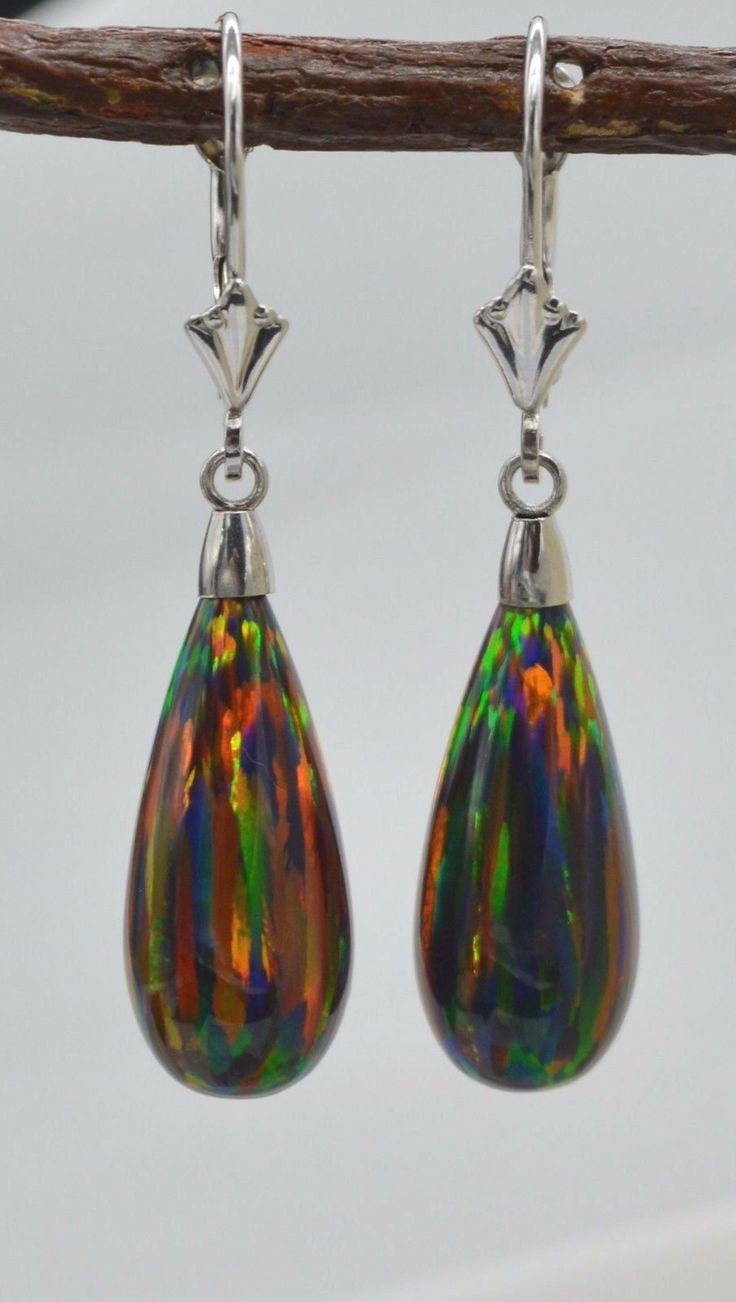 14K Solid White Gold Tear Drop Black Fire Opal Lever back Dangle Earrings fit all periods and are indefectible for diurnal wear to completely parade your style and make you beautiful. Specifications: Metal 14k White Gold (Not Plated) Style Opal Leverback Earrings Finish High Polished Earring Type Dangle (Drop) Gem Black Green Opal Main Stone Shape Tear Drop Main Stone Creation Synthetic Fastening Leverback Stamp 14K Height 37 mm (1.5 mm) Width 8 mm Metal Details Type - 14k solid gold Black Fire Opal, Black Fire, Makes You Beautiful, Leverback Earrings, Green Opal, Gold Drop Earrings, Tear Drop, Fire Opal, Jewelry Earrings Dangle