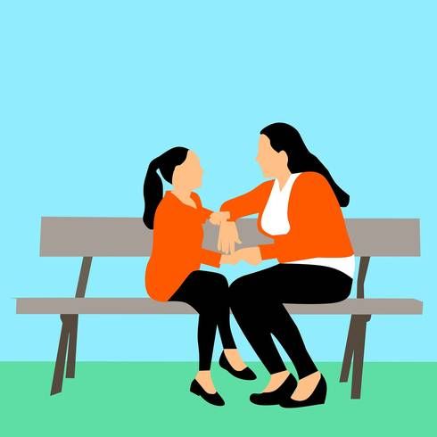 two women are sitting on a bench and one is holding the other's hand