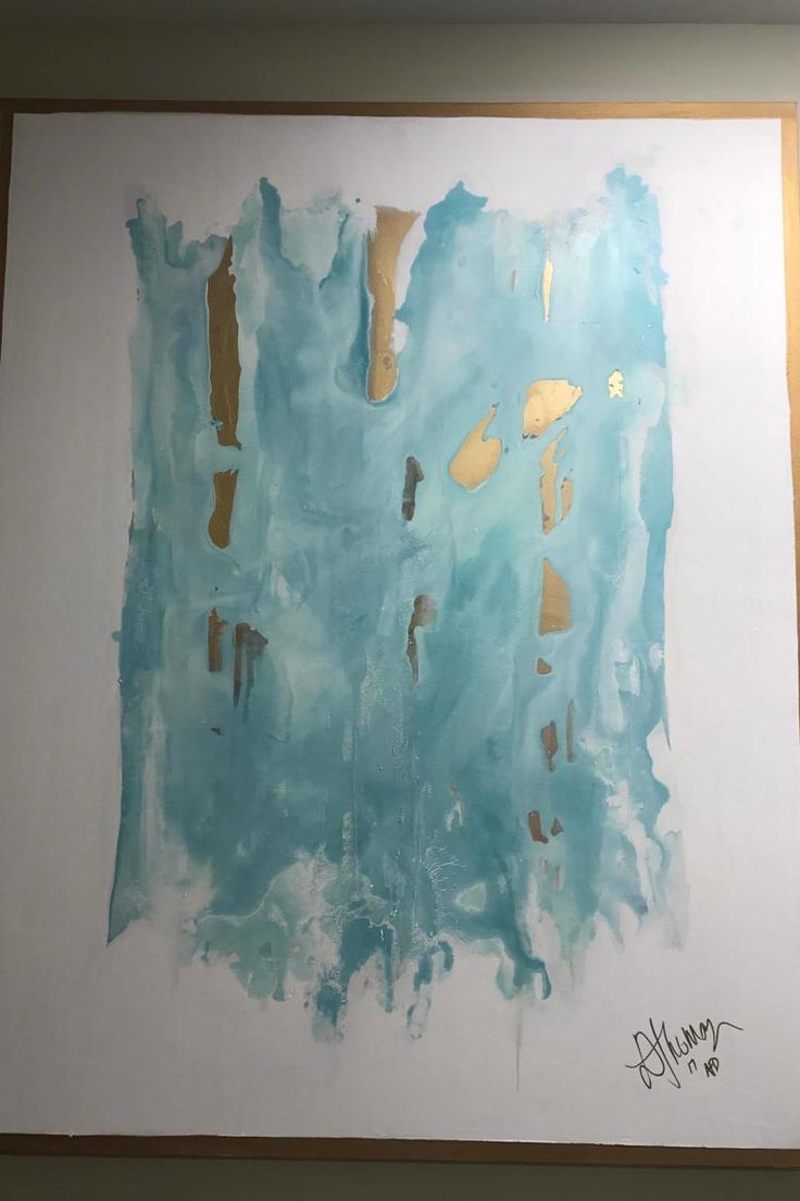 an abstract painting with blue and gold paint