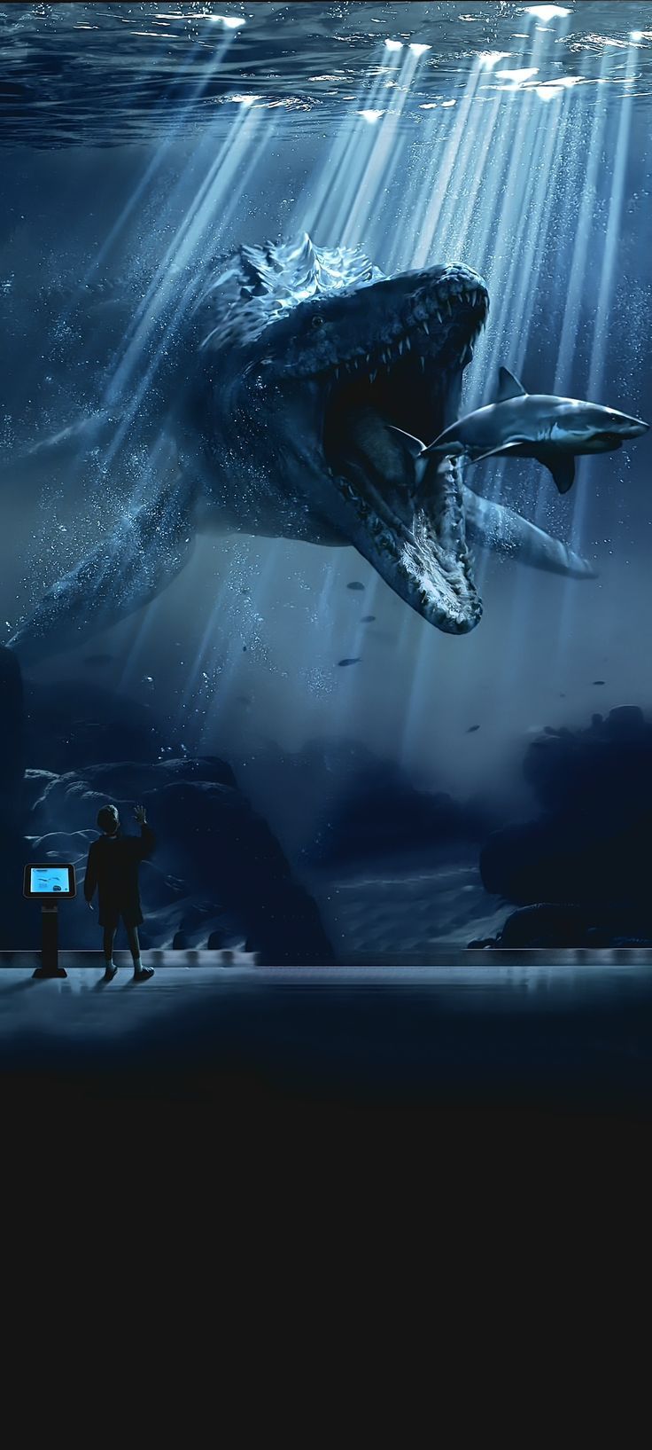 two people standing in front of a large whale swimming under water with beams of light coming from it's mouth