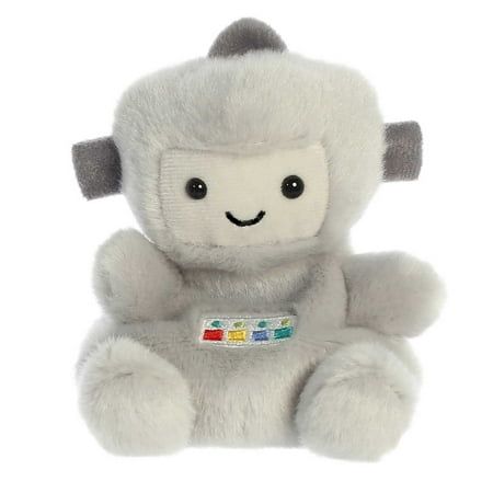 a gray stuffed animal sitting on top of a white floor