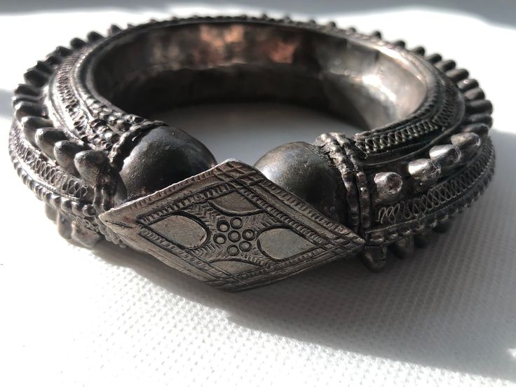 Gorgeous Hefty Ethnic Tribal Spiked Yemeni silver bracelet/bangle with very intricate workmanship and in very good condition with no broken or missing spikes. Collectors piece made in the early 1900s by tribes in Southern Arabia and Northern Africa. These type of bracelets are perfectly wearable and were often given on the occasion of the wedding to the bride  Dimensions: outer diameter 4.5" _  inner diameter 2.5" outer circumference 13.5"  _  inner wearable circumference 8"  1" tall  _  Weighs 163.7 Grams Any questions please ask! Shipped with USPS First Class Package.  Handsome African design.  Please browse the gallery to see our inventory.  Just Gorgeous!  Please refer to photos for more details on markings, size and condition. All weights, measurements and colors are approximate and m Traditional Ceremonial Bangle With Filigree, Traditional Ceremonial Filigree Bracelets, Traditional Filigree Bracelets For Ceremonial Use, Traditional Filigree Bracelets For Festivals, Metal Bangle With Intricate Design For Festival, Ceremonial Oxidized Finish Bracelets For Festivals, Traditional Metal Bangle Bracelets, Traditional Antique Silver Cuff Bracelet With Oxidized Finish, Ornate Oxidized Cuff Bracelet Bangle