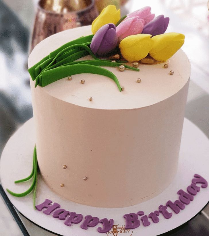 there is a birthday cake with flowers on it