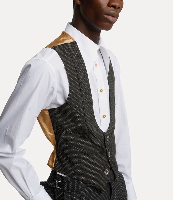 Our Horseshoe waistcoat adopts a U-shape silhouette, complete with this season's woven 'Raindrops' stitch - emulating the look and feel of raindrops on the woollen fabric. The design is reminiscent of classic English tailoring and features a contrasting orb jacquard silhouette to modernise the style. Fitted Wool Vest For Fall, Fitted Vest With Hidden Button Closure For Fall, Fitted Wool Vest For Tailoring, Woollen Fabric, Black Vivienne Westwood, Shape Silhouette, Suit Ideas, Waist Coat, Men Trousers