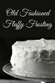 an old fashioned frosted fluffy frosting cake on a glass platter with the words, old fashioned fluffy frosting