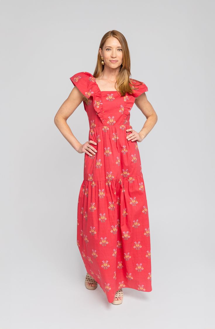 Things we love about the Copeland Dress, a list: Flutter sleeves. A flattering tiered skirt. Pockets! And the bold raspberry red floral with pops of pink and citrus hues. The maxi-length dress stuns on its own, but we love it paired with a cropped jacket—denim and leather both work great. Details Red floral print Pockets Maxi dress 100% cotton fabric Fit Notes Jacklene takes a S in this style Care Instructions Machine wash cold Gentle cycle Do not bleach Lay flat to dry Iron low Shipping Ships in 3 to 5 business days Red Tiered Skirt Maxi Dress For Spring, Red Tiered Maxi Dress For Spring, Pink Casual Maxi Dress With Flutter Sleeves, Red Tiered Maxi Dress With Ruffles, Red Ruffled Maxi Dress For Garden Party, Casual Red Tiered Maxi Dress, Red Tiered Maxi Dress With Floral Print, Red Floral Print Tiered Maxi Dress, Red Tiered Ruffle Maxi Dress