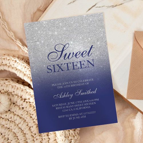 a blue and silver ombreed sweet sixteen birthday party card on a table next to a wicker basket