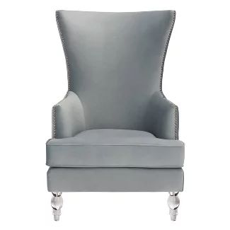 a grey chair with silver legs and nail accents