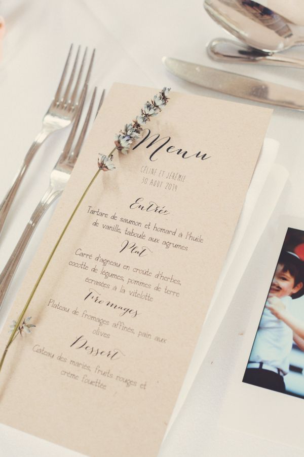 a table setting with silverware and menu cards