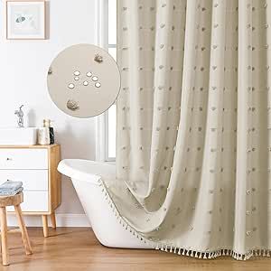 a white bath tub sitting under a window next to a wooden table and stools