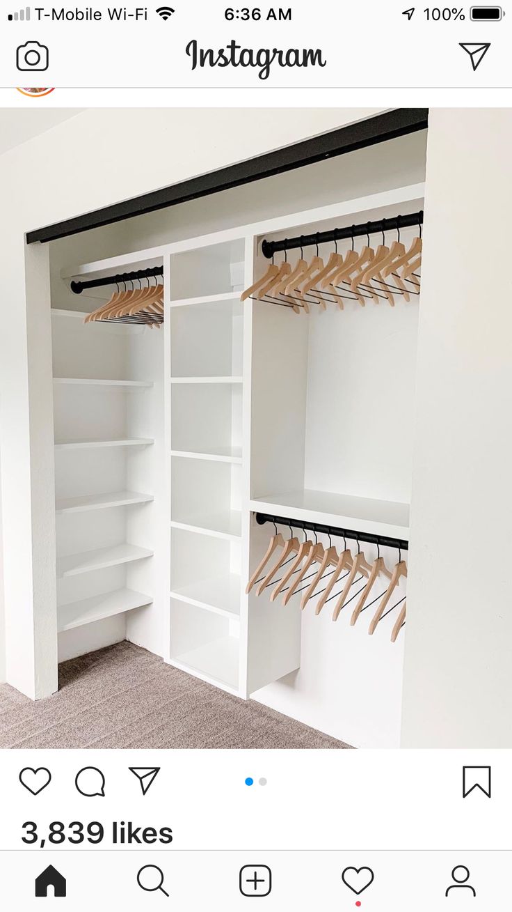 a white closet with shelves and clothes hanging on the hooks, in front of an instagram page