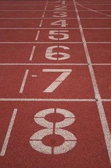 a red running track with numbers painted on it