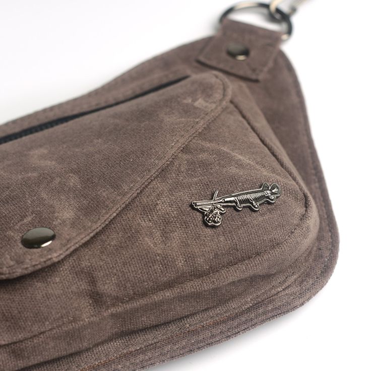 An earthy muted brown. The Lux Hip Pouch conforms to your body, keeps a slim profile and a sleek comfortable fit. Premium materials to keep things looking sharp while toting your essentials any time you want your hands free for doin' stuff. Rock it at the park, farmer’s market, music festivals, walks around the neighborhood, roller skating or a night out. -Available in 3 size options. Size 1 (XS-Medium) 28"-37”; Size 2 (Medium-XL) 33"-47"; Size 3 (XL-3XL) 42-64" -3 zippered compartments. 1 on th Functional Brown Pouch For Everyday Use, Casual Everyday Pouch With Cell Phone Pocket, Everyday Brown Pouch With Zipper Pocket, Functional Brown Travel Pouch, Brown Anti-theft Pouch Bag, Versatile Brown Pouch For Everyday Use, Brown Pouch With Cell Phone Pocket For Everyday Use, Versatile Brown Pouch For Daily Use, Brown Everyday Pouch With Cell Phone Pocket