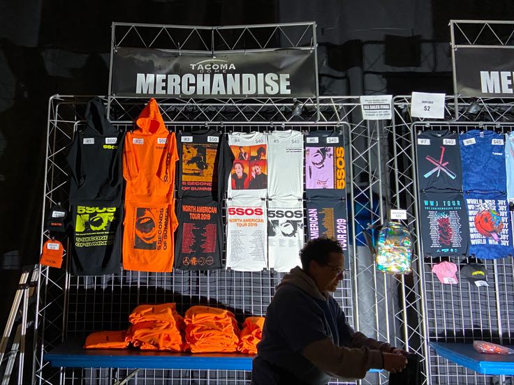 a man standing in front of a display of merchandise