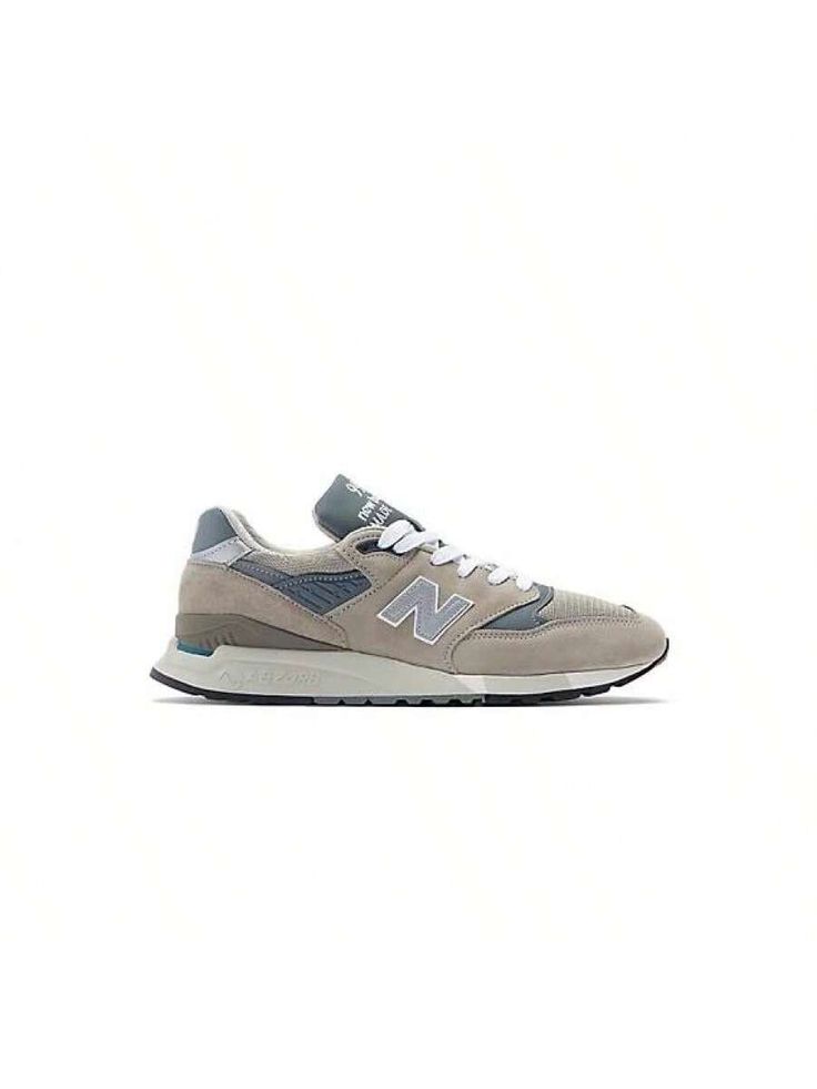 A true embodiment of New Balance's timeless design and performance innovation returns to the MADE in USA lineup in 2023. The original 998, released in 1993, was the first shoe to utilize ABZORB cushioning.  This revolutionary step forward in shock absorption was matched visually with a sleek update to the classic 99X series look. The MADE in USA 998 features an OG grey colorway in a premium pigskin suede and mesh upper construction. 
New Balance MADE U.S. footwear contains a domestic value of 70 Casual Athletic Shoes, In Shock, Pig Skin, Outdoor Shoes, New Balance, Timeless Design, Outdoor Sports, Made In Usa, Athletic Shoes