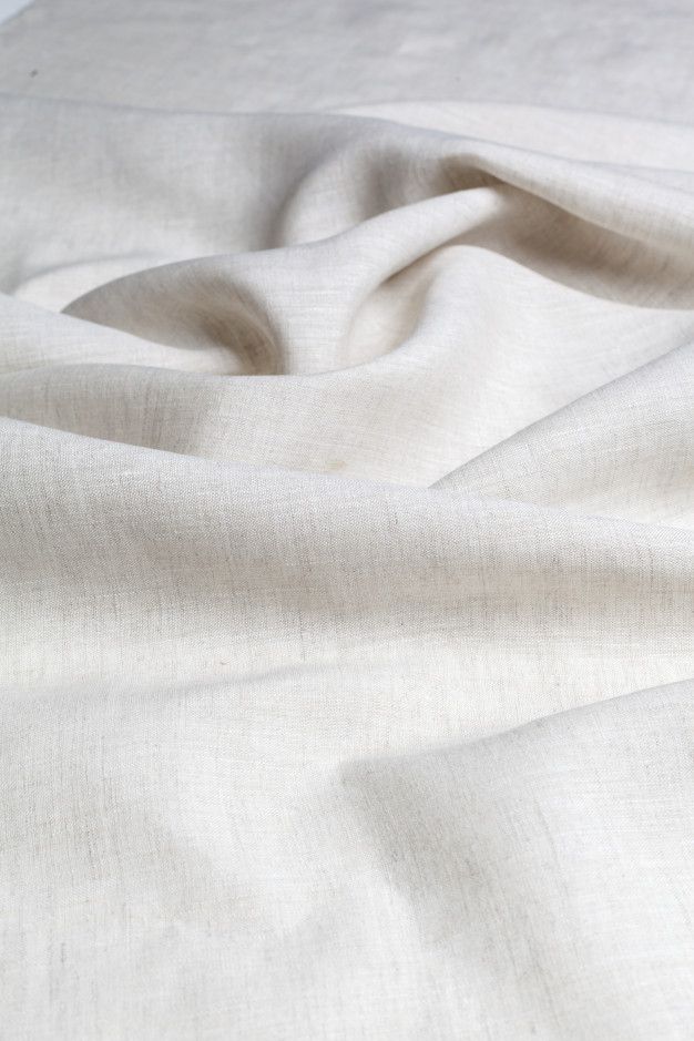 a close up view of a plain white linen material that is very soft and wrinky