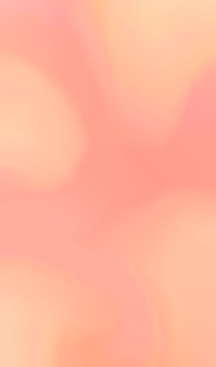 a blurry image of an orange and pink background