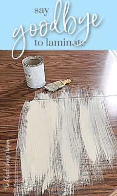 the words say goodbye to laminate on top of a wooden table with white paint