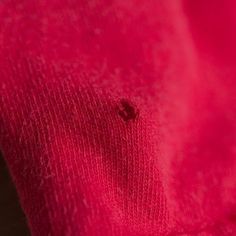 a close up view of a red sweater