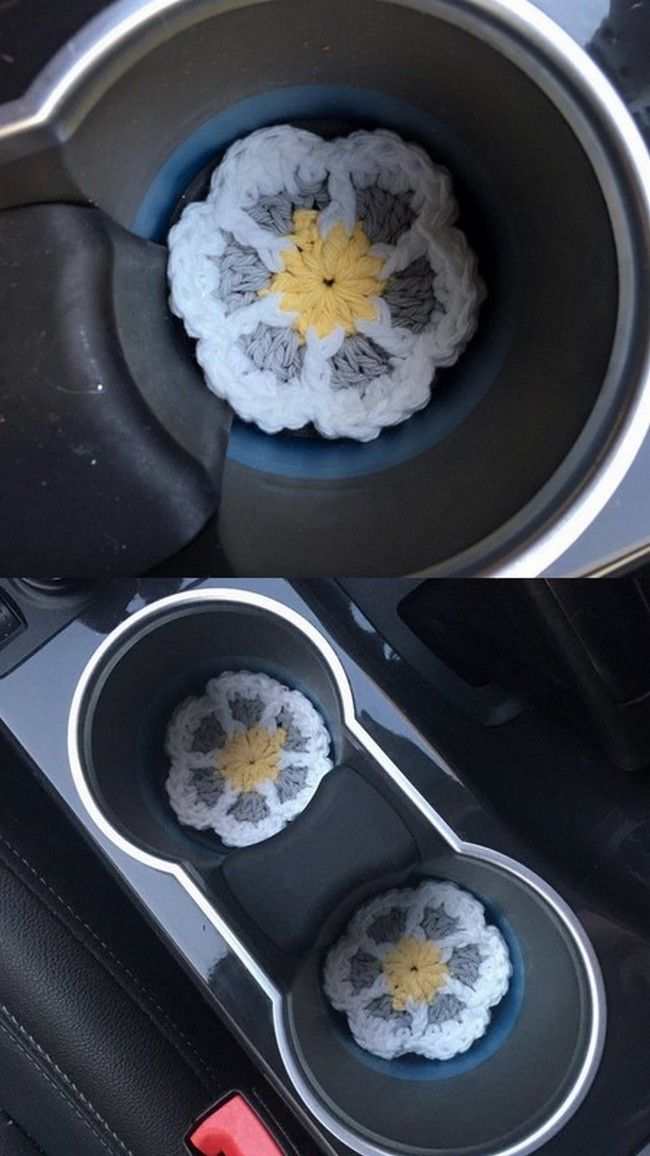 two muffin cups in the center of a car with yellow and white crochet flowers