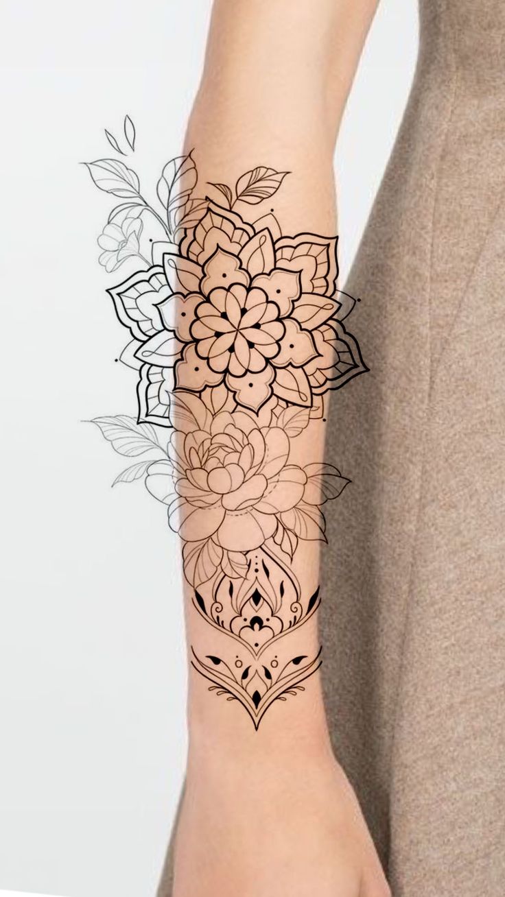 a woman's arm with a flower tattoo on it