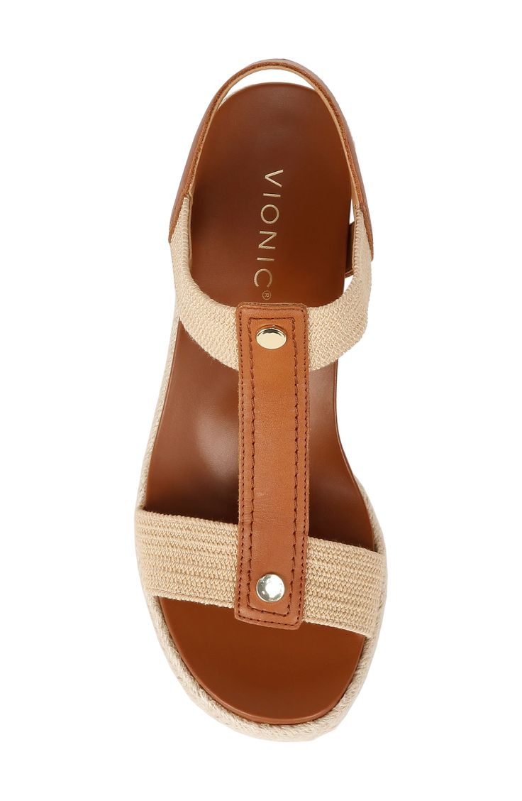 Step comfortably into summertime styling in this espadrille wedge sandal made for comfort and ease with a VIO MOTION™ footbed and slip-on-enabling gore insets. 2 1/2" heel; 3/4" platform (size 8.5) Pull-on style with elastic gore insets Cushioned EVA footbed with arch support Leather upper/synthetic lining and sole Imported Comfortable Espadrille Wedge Heel Sandals, Comfortable Wedge Heel Sandals For Spring, Spring Wedge Heel Sandals With Textured Sole, Comfortable Spring Wedge Heel Sandals, Casual Leather Wedge Sandals For Beach Season, Beige Wedge Espadrilles With Textured Sole, Vacation Wedge Sandals With Textured Sole, Spring Espadrille Wedge Sandals With Textured Sole, Summer Espadrille Wedge Sandals With Textured Sole