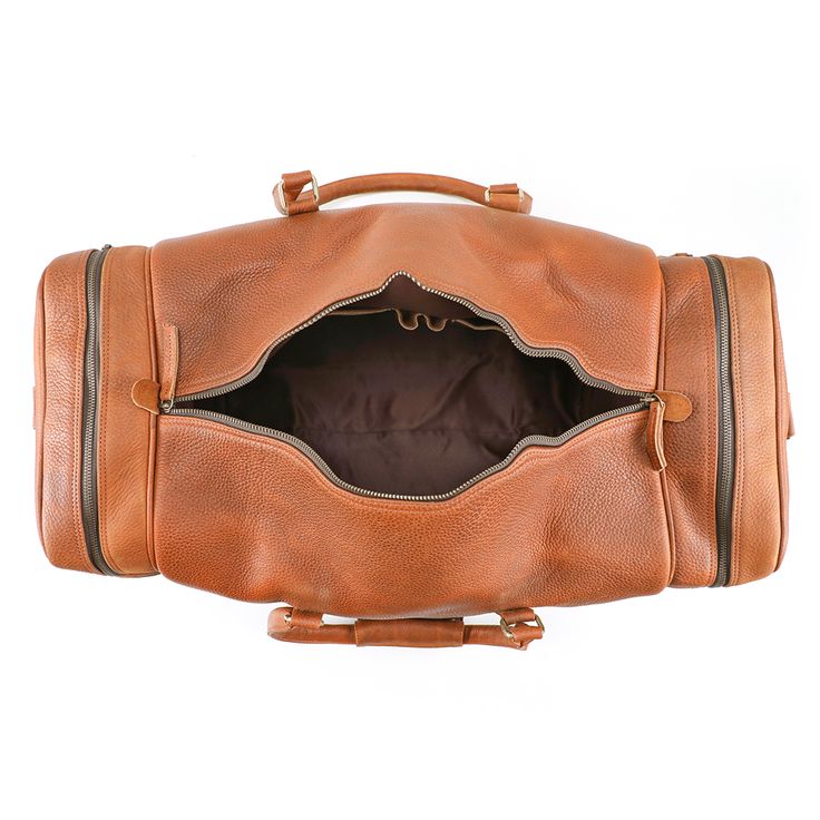 Your Favorite Duffle Just Got a Makeover. BECAUSE EVERYONE DESERVES A DO OVER. Meet the new and improved version of The Travel, the only duffel bag you’ll ever need. Like, ever. A Men’s Leather Duffel Bag FTW HANDSOME, RUGGED, SPACIOUS…WHAT A CATCH Every serious traveler needs a serious duffel; something roomy; something that opens from everyside; something that’s got beauty to match its brawn. A quick Google will introduce you to plenty of duffle bags on the market, but do you really want to ch Leather Duffel Bag, Leather Duffel, Perfect Tan, Leather Duffle Bag, Leather Duffle, Duffle Bags, New And Improved, How To Look Classy, Duffel Bag