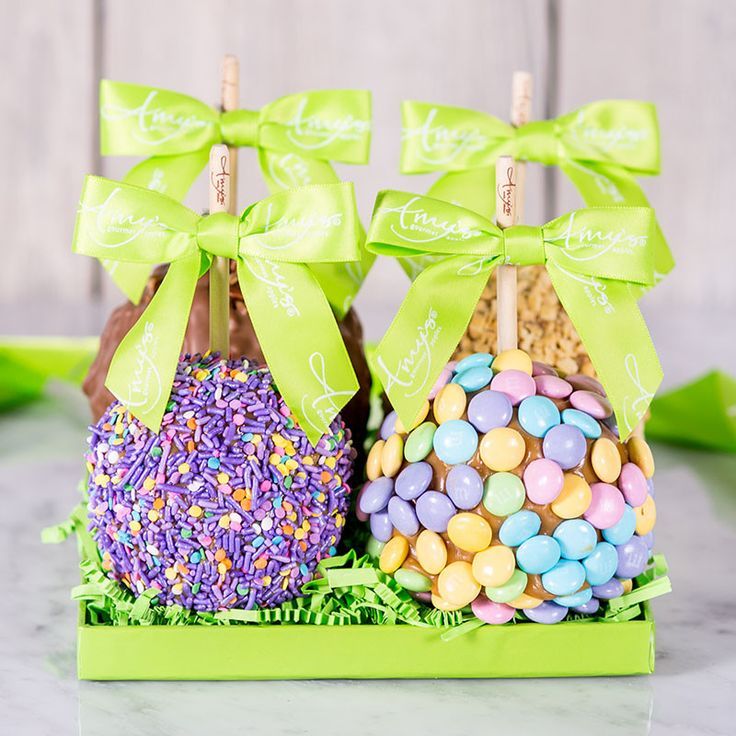 two easter eggs with green bows and sprinkles