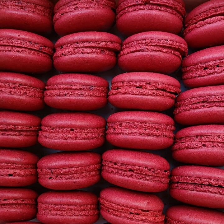 red macaroons stacked on top of each other