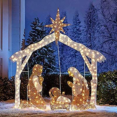 lighted nativity scene in front of a house