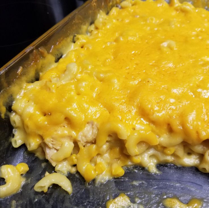 a casserole dish with chicken and cheese in it