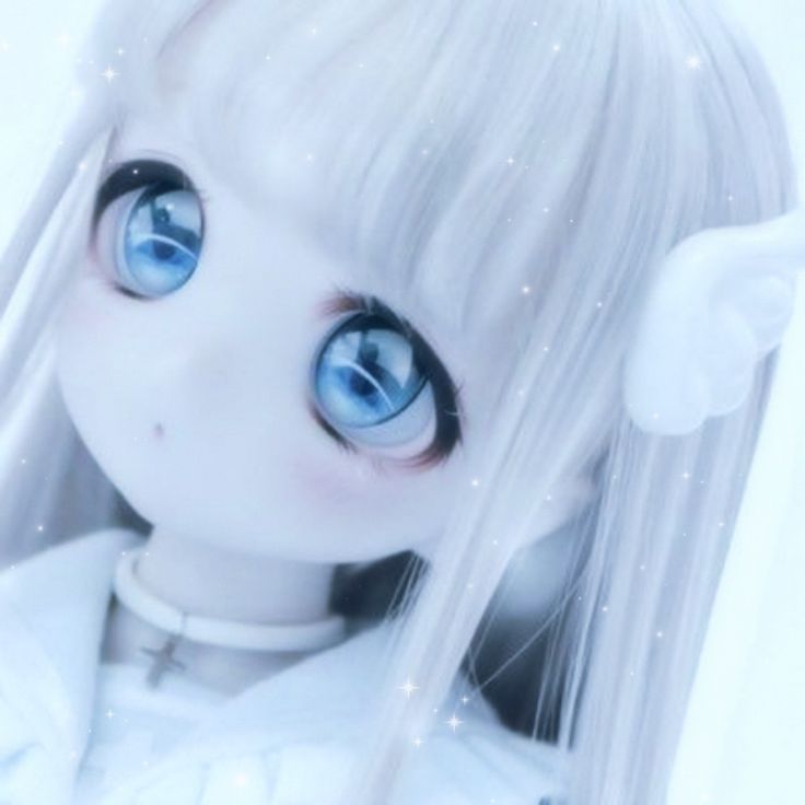 a white doll with blue eyes and long hair