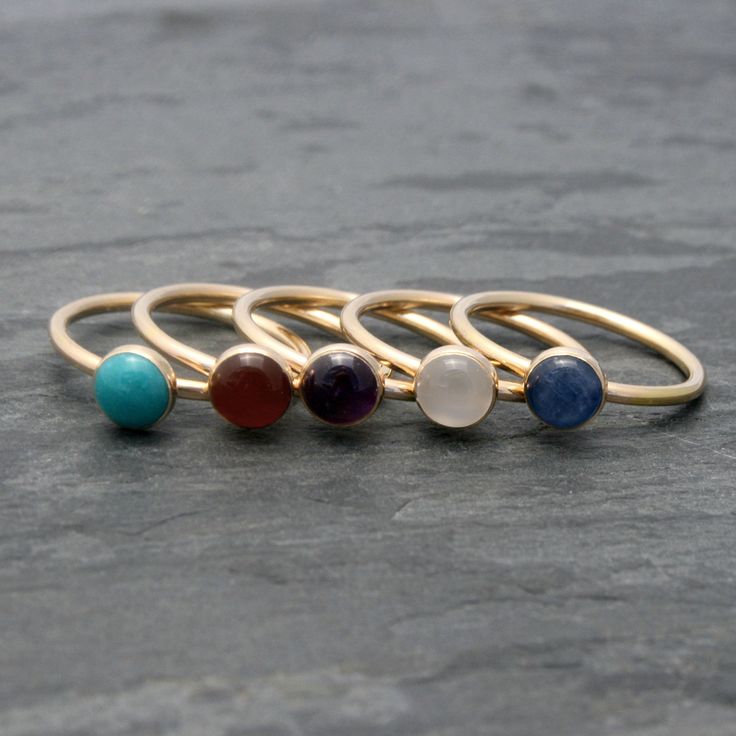 Create your own unique set of stacking rings. Select a stacking ring to represent your birthday or the birthdays of the ones you love. Or, create your own colorful set by mixing and matching your favorite colors and gemstones. The gems are 6mm. Set in 14k Gold-fill. I use durable, high quality 14k gold-fill to make these rings. 14 karat gold-fill has a thick layer of karat gold, not just a microscopic film, as is the case with gold-plated and gold vermeil items. This ring will be made to order i Birthstone Engagement Rings, Gemstone Stacking Ring, Engagement Ring Band, Band Engagement Ring, Ring Band, Stacking Ring, Stackable Rings, Stacking Rings, Gold Style