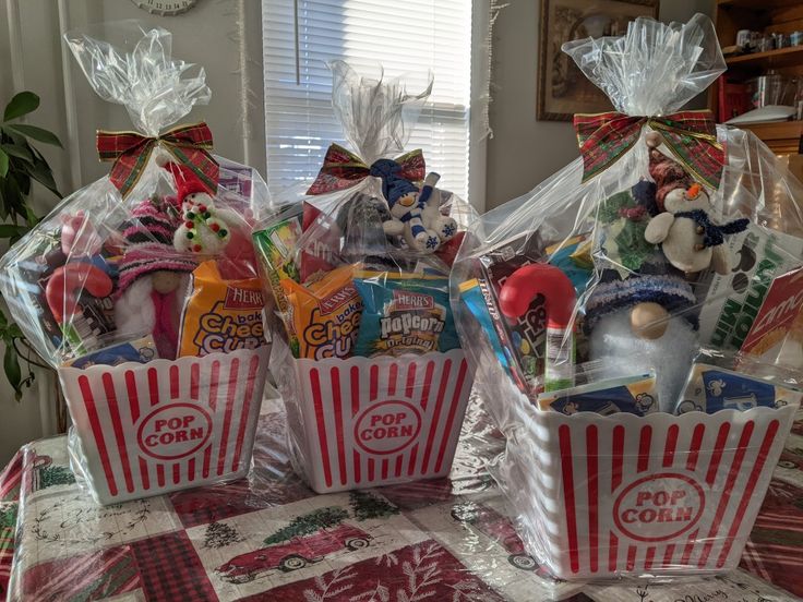 three baskets filled with candy and candies on top of a table