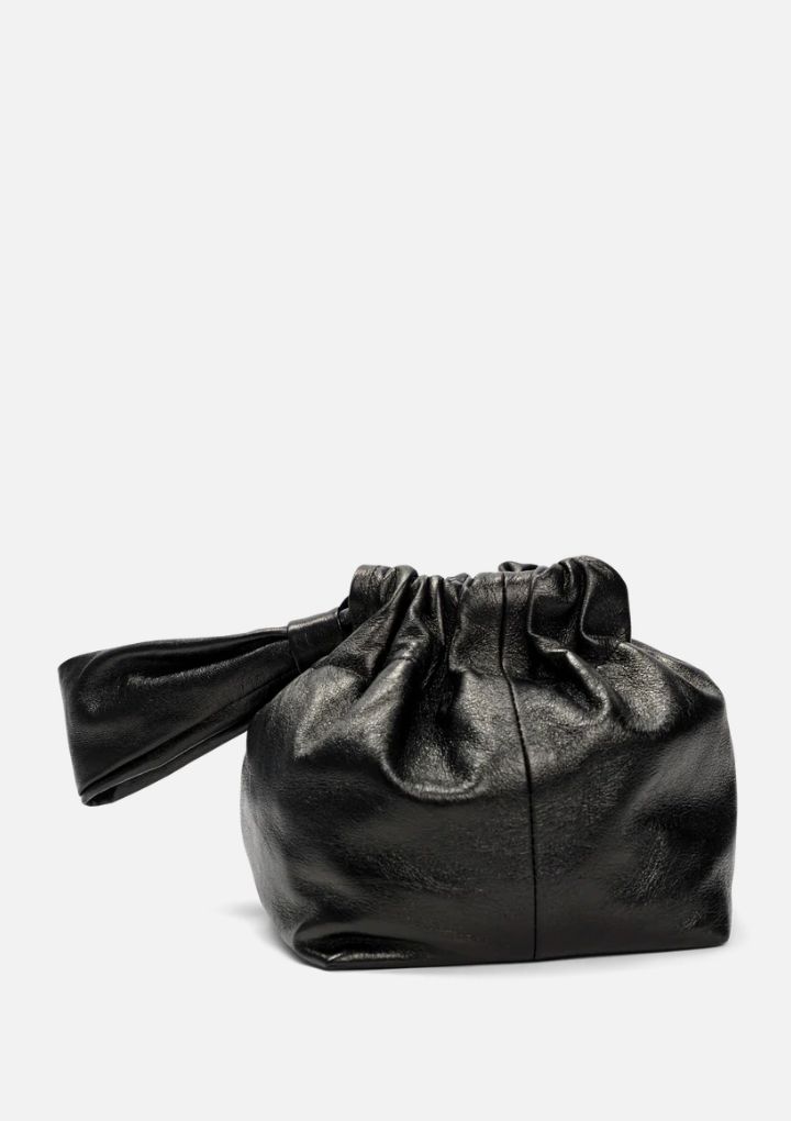 This beautiful Mariposa Bucket Bag captivates with its stunning metallic black hue and soft Italian lambskin leather. Enjoy the chic ruched look that gathers to cleverly close, plus a soft leather handle to carry on your wrist. Whether a special occasion or a spur of the moment adventure, its unique style will ensure you look and feel great! 6" x 6"w, 7" h Made in Los Angeles, CA Black Leather Handheld Pouch, Black Leather Top Handle Pouch, Textured Leather Evening Pouch Bag, Evening Textured Leather Pouch Bag, Elegant Black Bag With Rolled Handles, Elegant Black Shoulder Bag With Rolled Handles, Leather Clutch With Detachable Handle For Party, Leather Top Handle Clutch For Party, Luxury Soft Leather Party Clutch