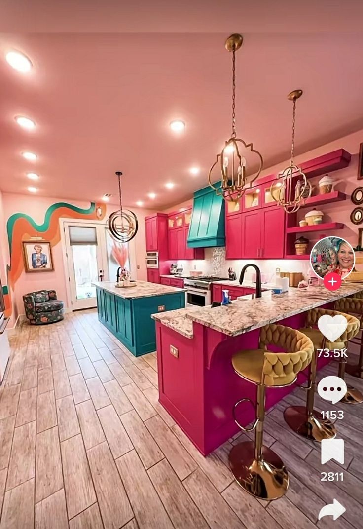 the kitchen is decorated in pink, blue and green colors with lots of counter space